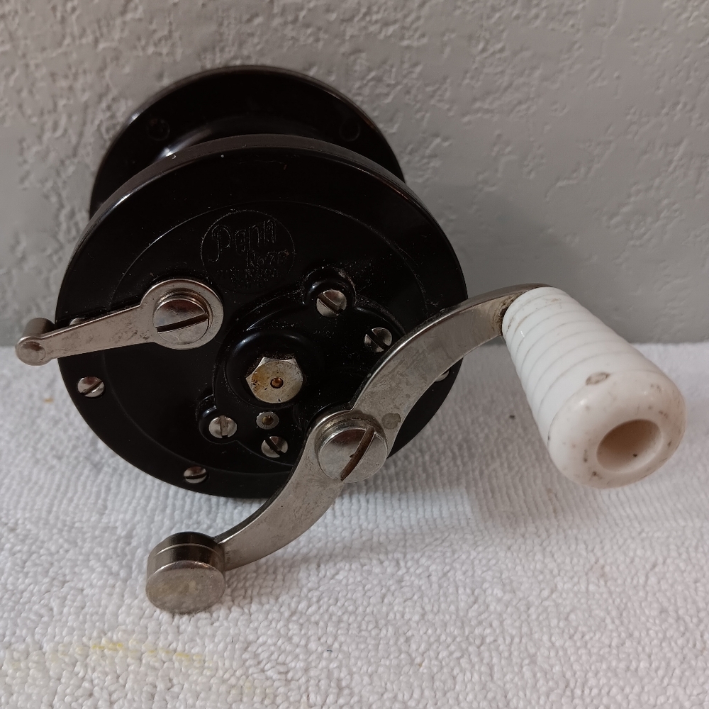 78-Penn Black Fishing Reel with White Handle